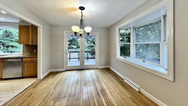 9 Brooks Rd, Sudbury, MA 01776 - entryway featuring baseboards, a baseboard radiator, an inviting chandelier, and light wood-style flooring