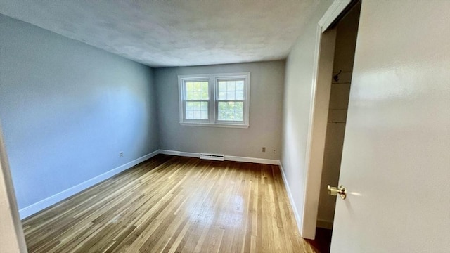 9 Brooks Rd, Sudbury, MA 01776 - unfurnished bedroom with baseboards, visible vents, and wood finished floors