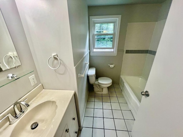 9 Brooks Rd, Sudbury, MA 01776 - bathroom with tile patterned floors, toilet, vanity, and a wainscoted wall