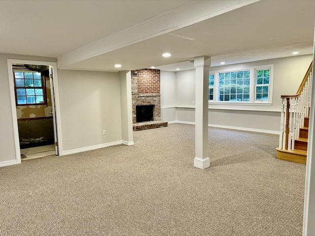 9 Brooks Rd, Sudbury, MA 01776 - unfurnished living room featuring stairs, carpet flooring, recessed lighting, and a brick fireplace
