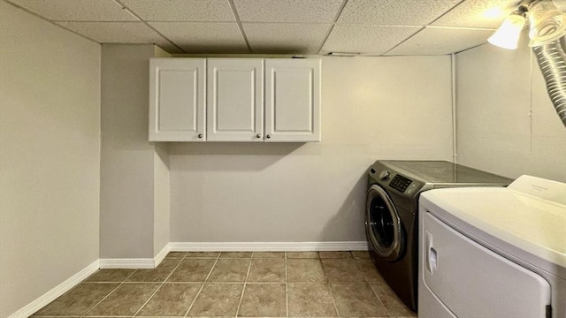 9 Brooks Rd, Sudbury, MA 01776 - laundry room with cabinet space, washing machine and clothes dryer, dark tile patterned flooring, and baseboards