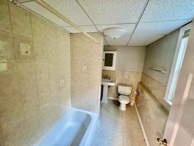 9 Brooks Rd, Sudbury, MA 01776 - bathroom featuring toilet, tile walls, tile patterned floors, and a paneled ceiling