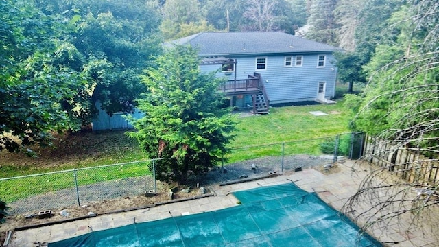 9 Brooks Rd, Sudbury, MA 01776 - view of pool with a lawn, a wooden deck, stairway, a fenced backyard, and a fenced in pool