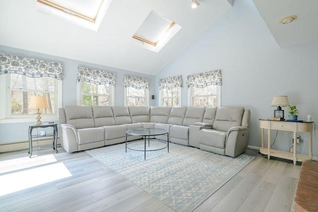 living room featuring a skylight, wood finished floors, high vaulted ceiling, baseboards, and a baseboard radiator
