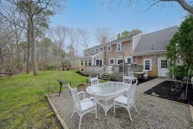view of patio featuring outdoor dining area and a deck