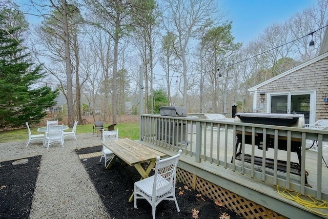 view of patio / terrace featuring outdoor dining space and a deck