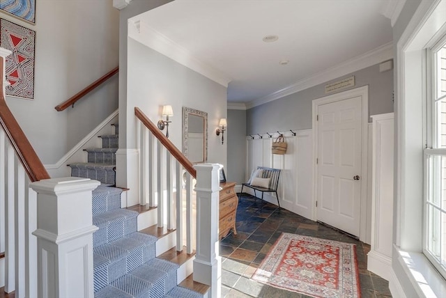 entryway featuring crown molding