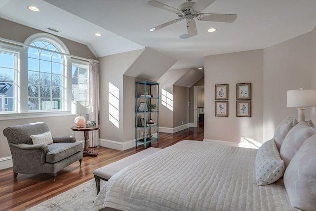 bedroom featuring ceiling fan, lofted ceiling, and wood-type flooring