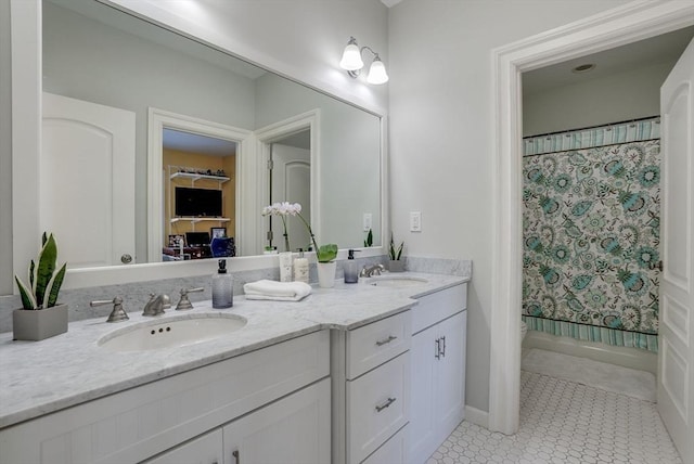 bathroom featuring vanity, curtained shower, and tile patterned floors