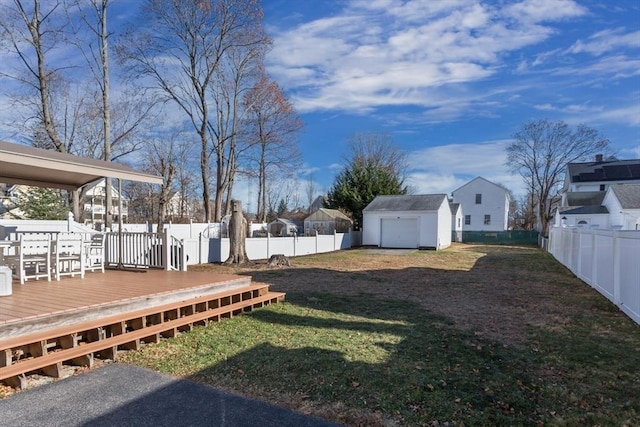 view of yard with a storage unit and a deck