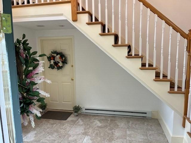697 Main St, Shrewsbury, MA 01545 - stairway with a baseboard radiator