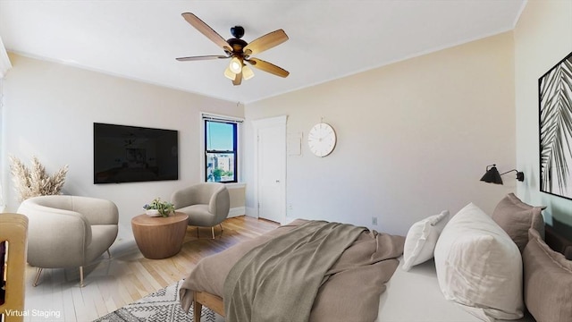 bedroom featuring ceiling fan and light hardwood / wood-style floors