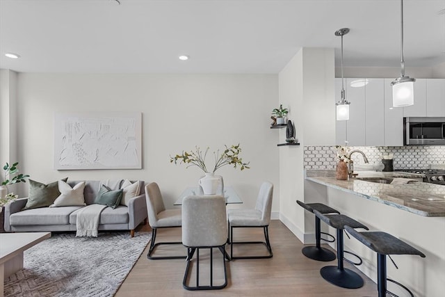 121 Portland St Unit 601, Boston, MA 02114 - dining space with wood finished floors, recessed lighting, and baseboards