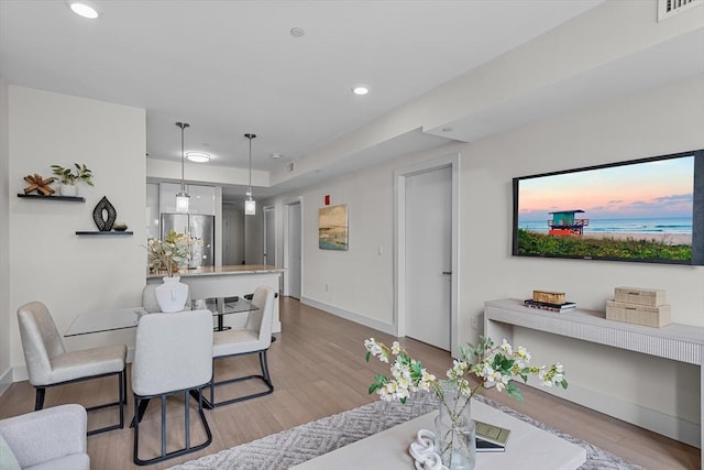 121 Portland St Unit 601, Boston, MA 02114 - dining area with light wood-style flooring, baseboards, and recessed lighting