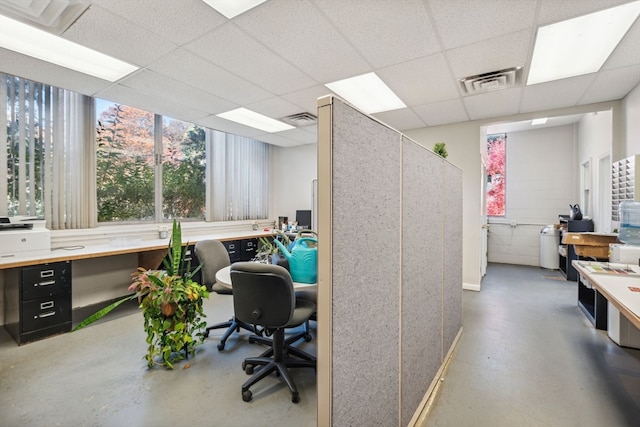 office featuring built in desk and a paneled ceiling