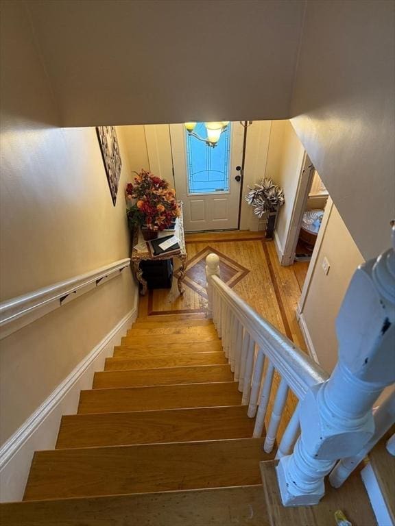 stairs with hardwood / wood-style floors