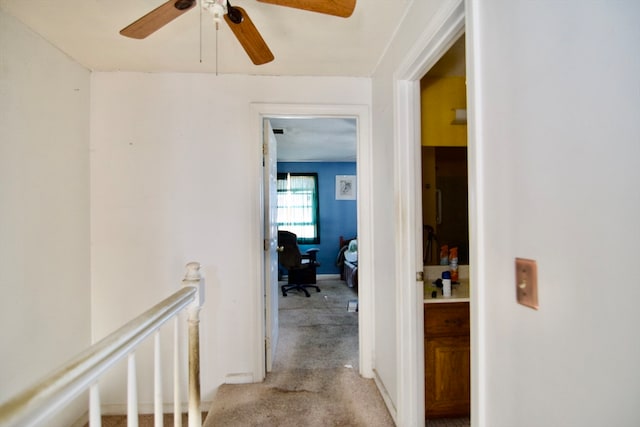 hallway with light carpet