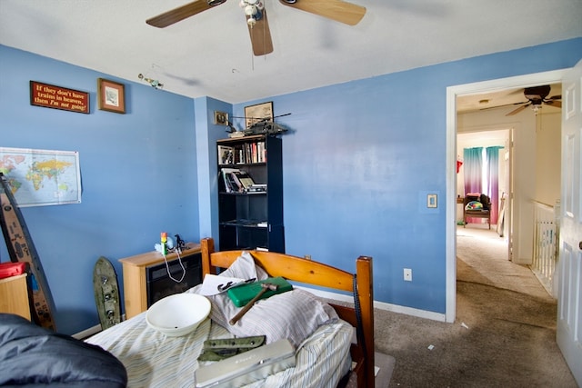 bedroom with ceiling fan and carpet flooring