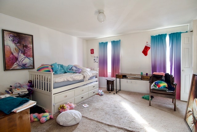 bedroom with light colored carpet