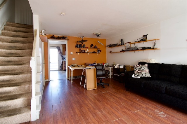 unfurnished living room with hardwood / wood-style flooring