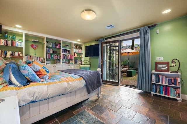 bedroom featuring stone tile floors, recessed lighting, visible vents, and access to exterior