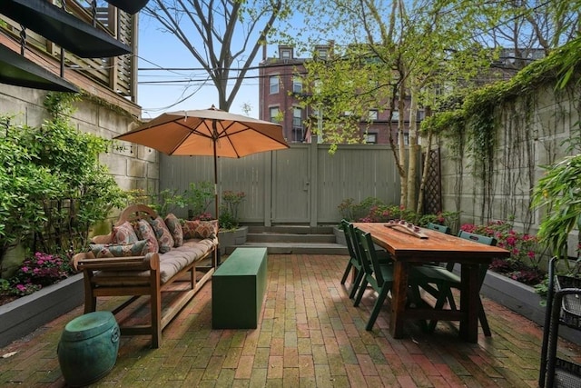 view of patio / terrace with a fenced backyard, outdoor lounge area, and outdoor dining space
