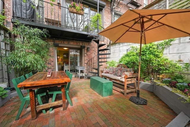 view of patio / terrace with an outdoor living space, stairs, and outdoor dining area