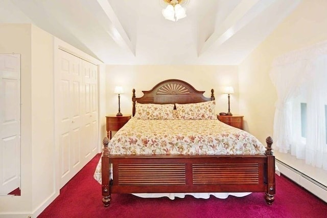 carpeted bedroom with baseboard heating, a closet, and beamed ceiling