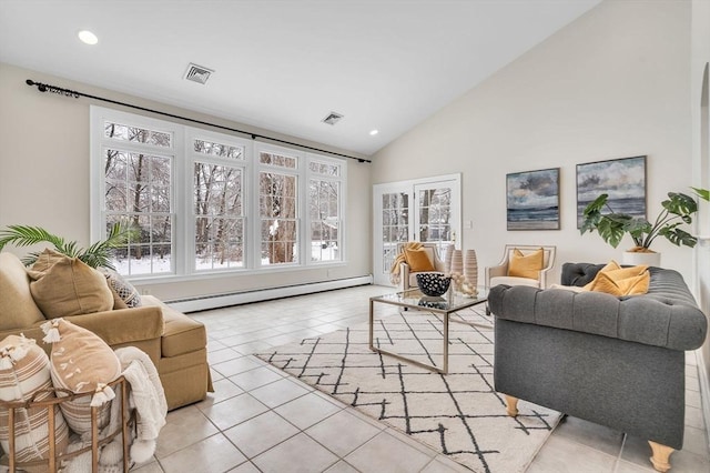 tiled living room with high vaulted ceiling, baseboard heating, and a wealth of natural light