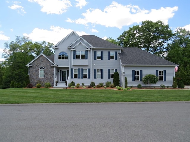 71 Frasier Ln, Tewksbury, MA 01876 - view of front of property featuring a front yard and roof with shingles