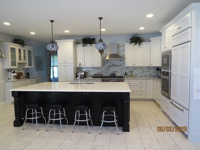 71 Frasier Ln, Tewksbury, MA 01876 - kitchen with wall chimney exhaust hood, built in appliances, light countertops, backsplash, and recessed lighting