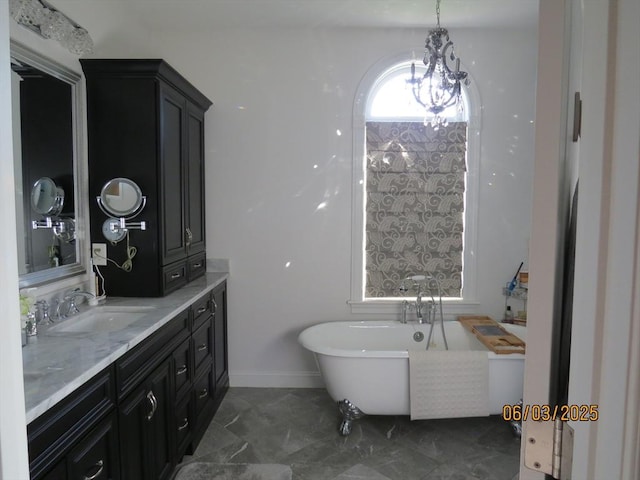71 Frasier Ln, Tewksbury, MA 01876 - bathroom featuring a soaking tub, vanity, and marble finish flooring