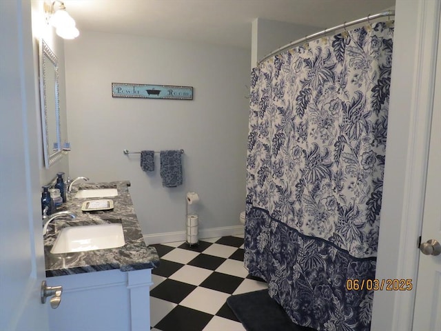 71 Frasier Ln, Tewksbury, MA 01876 - full bathroom with tile patterned floors, double vanity, and a shower with curtain