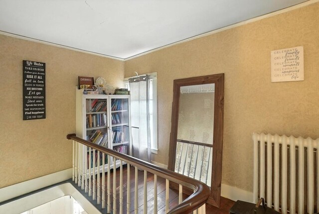 97 Newton St, Marlborough, MA 01752 - hallway featuring radiator heating unit and crown molding