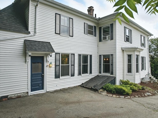 97 Newton St, Marlborough, MA 01752 - view of front of property with a chimney, roof with shingles, and cooling unit