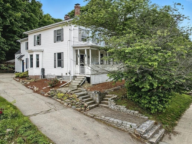 97 Newton St, Marlborough, MA 01752 - view of front of house featuring a chimney, a porch, and stairs