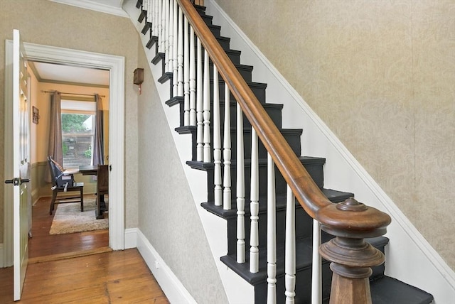 97 Newton St, Marlborough, MA 01752 - staircase with wood finished floors, wallpapered walls, and ornamental molding