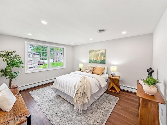 78 Howland Rd, Stoughton, MA 02072 - bedroom featuring baseboard heating, a baseboard heating unit, dark wood-style floors, and recessed lighting
