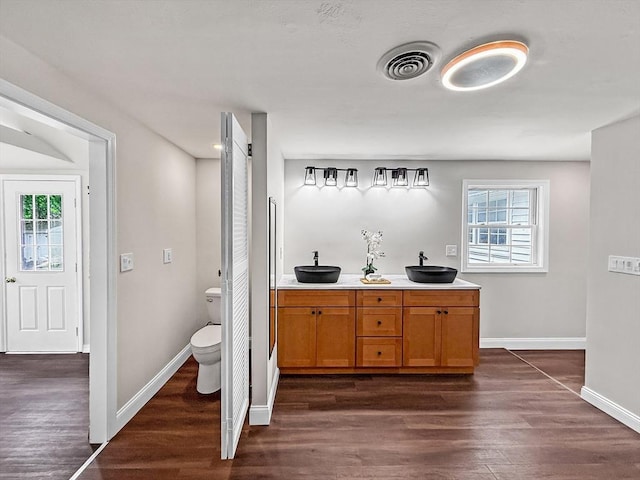 78 Howland Rd, Stoughton, MA 02072 - full bathroom with wood finished floors, plenty of natural light, and baseboards
