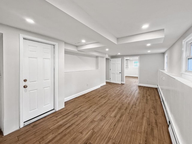 78 Howland Rd, Stoughton, MA 02072 - basement featuring a baseboard heating unit, wood finished floors, recessed lighting, and baseboards