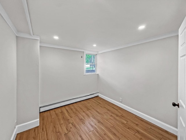 78 Howland Rd, Stoughton, MA 02072 - spare room featuring a baseboard heating unit, wood finished floors, ornamental molding, baseboards, and recessed lighting