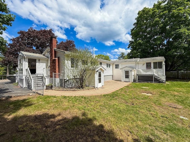 78 Howland Rd, Stoughton, MA 02072 - back of house with a chimney