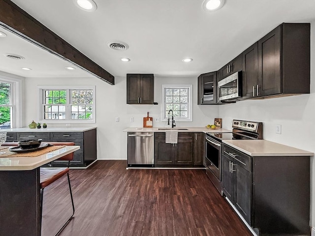 78 Howland Rd, Stoughton, MA 02072 - kitchen with stainless steel appliances, a sink, dark wood-style floors, plenty of natural light, and recessed lighting