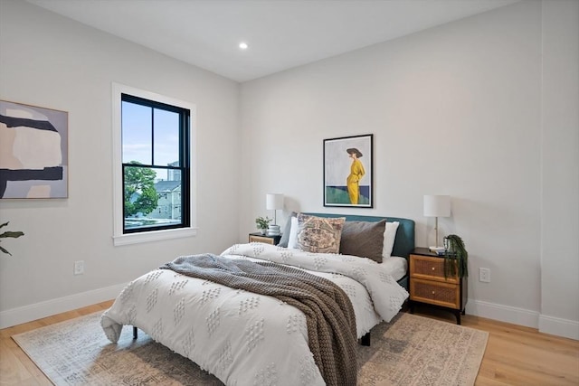 bedroom with light hardwood / wood-style floors