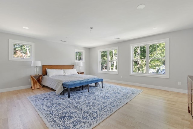 bedroom with light hardwood / wood-style floors