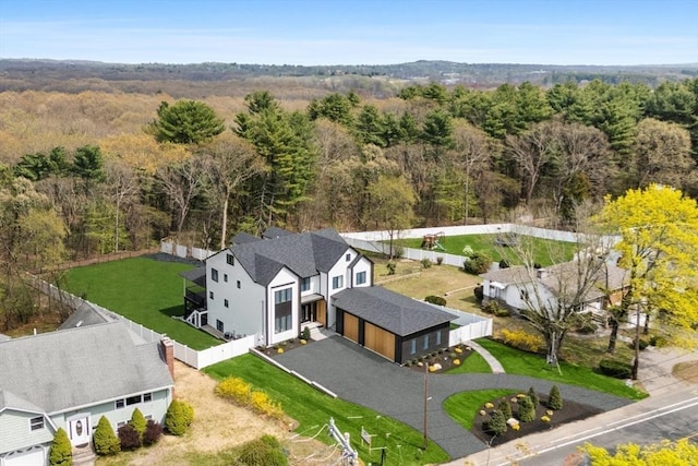 view of subject property featuring a heavily wooded area