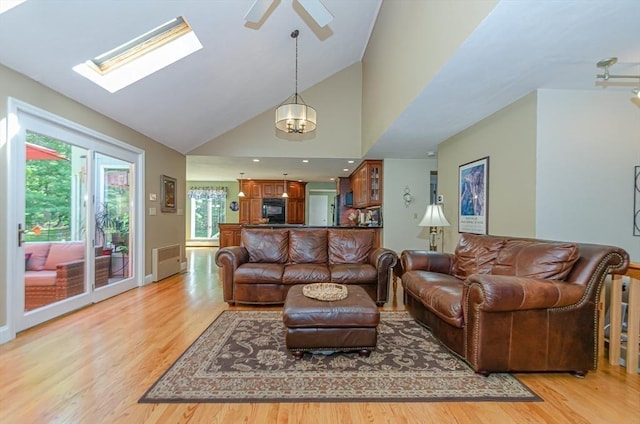 3 Riverside Dr, Mattapoisett, MA 02739 - living area featuring light wood-type flooring, ceiling fan, a skylight, and high vaulted ceiling