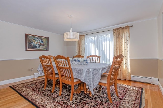 3 Riverside Dr, Mattapoisett, MA 02739 - dining room with a baseboard heating unit, crown molding, light wood-style flooring, and baseboard heating