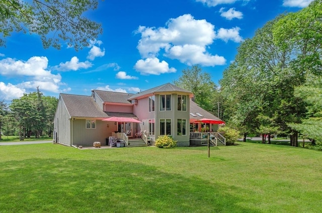 3 Riverside Dr, Mattapoisett, MA 02739 - back of property with a deck, a yard, and a shingled roof
