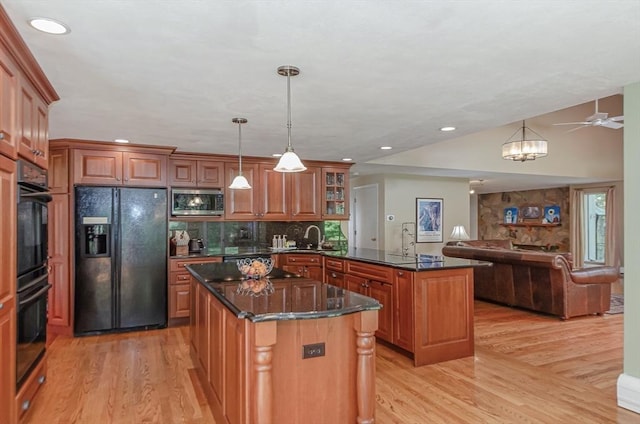 3 Riverside Dr, Mattapoisett, MA 02739 - kitchen with black appliances, light wood-type flooring, a peninsula, open floor plan, and recessed lighting